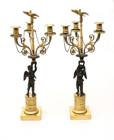 A pair of gilded bronce candle holder