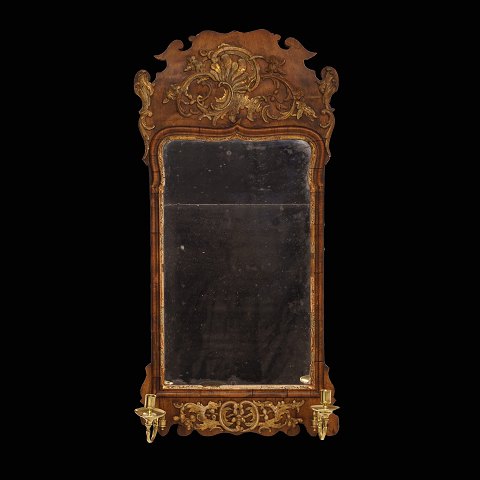 A 18th century gilt walnut mirror. Denmark circa 
1760. Size: 90x45cm