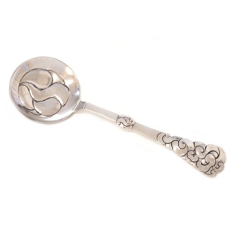 Silver serving spoon by Thorvald Bindesbøll and 
Holger Kyster 1909. L: 25cm. W: 99gr