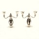 A pair of two light Georg Jensen candelabra, sterlingsilver. #244. Made in the 
period 1925-1932. Dated 1931. H: 21,2cm. B: 23,5cm. W: 2.849gr
