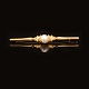 Evald Nielsen, Copenhagen: A brooch of 14ct gold. L: 6,3cm