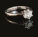 A 14kt gold solitaire ring with a brilliant cut diamond of 1,01ct. Ringsize 57. 
With grading report