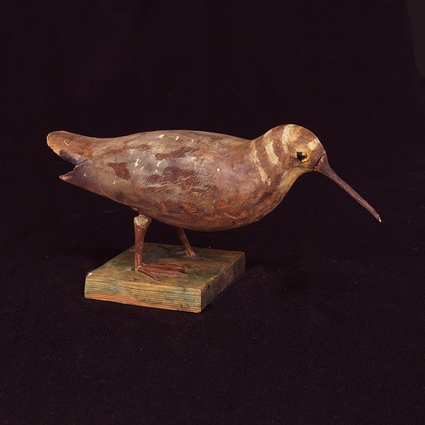 Swedish folkart: A bird, wood. Late 19th Century. H: 15cm. L: 32cm