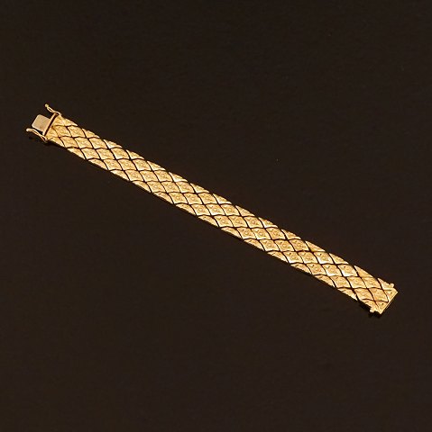Leddelt 18kt guld armlænke med rhombeformede led. L: 19,5cm. V: 33,5gr