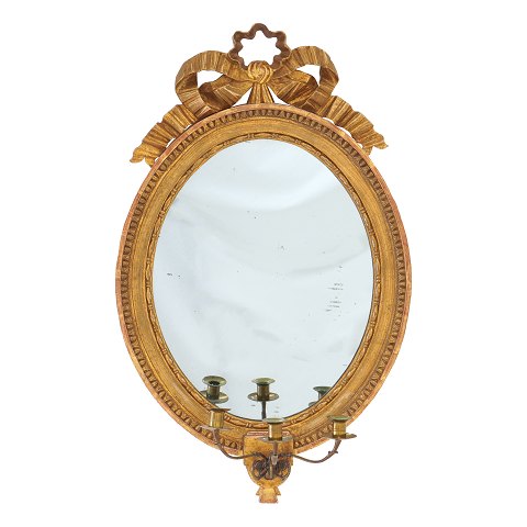 Large gilt Gustavian mirror for three candles. 
Sweden circa 1780-1800. H: 81cm. W: 51cm