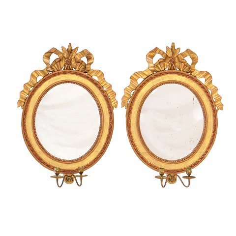 Pair of Gustavian gilt mirrors for two candles. 
Signed Stockholm 1799. H: 62cm. W: 46cm