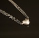 Ole Lynggaard, Denmark: Sterlingsilver necklace with 18kt gold Heart clasp. L: 
39cm