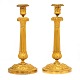 Pair of early 19th century French firegilt bronze candlesticks. France circa 
1810-20. H: 31cm