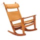 Hans J. Wegner Keyhole rocking chair. Oak and leather with patina. Designed 
1967. H: 102cm