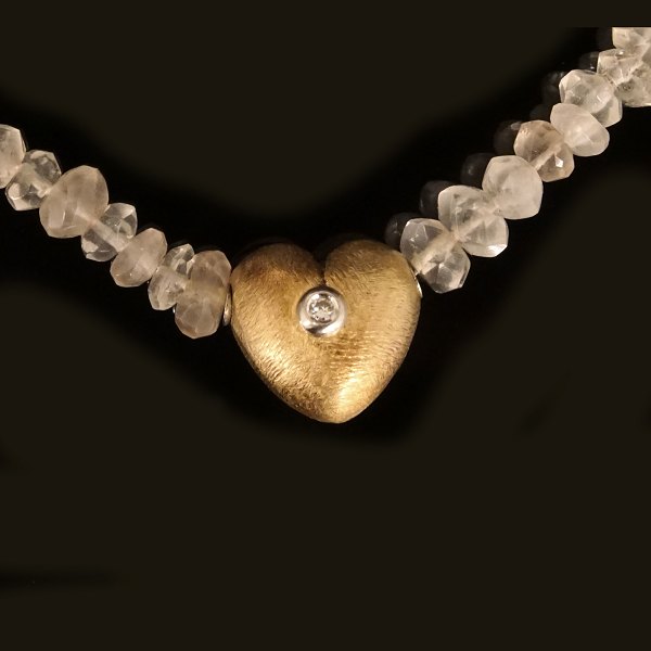 Ole Lynggaard hjerte lås i 14kt guld med brillant i hvidguldsfatning. Stemplet "Ole L 585". Mål: 13x11mm