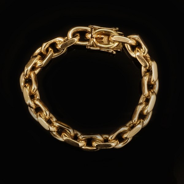 Anker armlænke i 14kt guld, meget kraftig. Stemplet Bjarne Nordmark Henriksen, København. L: 20,5cm. V: 83,9gr. Ledstr: 10x14mm